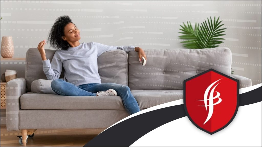A women enjoying fresh air on the couch.
